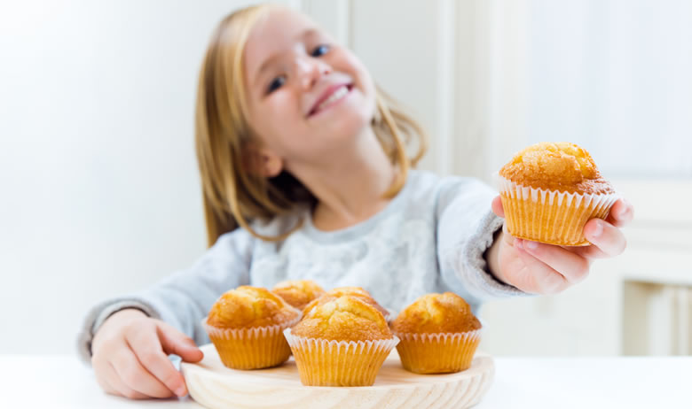 Little girl holding a cake stock photo