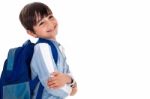 Happy Young Boy Ready For School With His Bag Stock Photo
