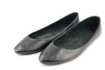 Lady Black Leather Ballet Flat Shoes On White Stock Photo