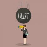 Heavy Debt Falling To Careless Business Woman Stock Photo