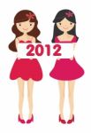 Girls Holding 2012 New Year Card Stock Photo