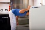 Man Looking In Refrigerator Stock Photo