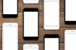 Phone Set On Wood Table, Mock-up Phone Set Blank Screen For App Stock Photo