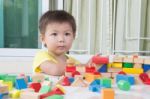 Three-year Child Plays With Toy Blocks Stock Photo