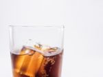 Close Up Two Of Thirds Soft Drink Is Cool And Ice Cubes  In Glass On White Background Stock Photo