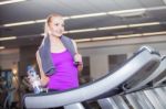 Attractive Young Woman After Running On A Treadmill, Exercise At Stock Photo