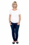Full Length Portrait Of Trendy Middle Aged Woman Stock Photo