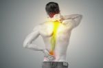 Young Man Has Pain In His Back Stock Photo