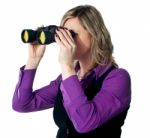Businesswoman Looking Through Binoculars Stock Photo