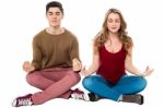 Friends Meditating In Lotus Pose, Peace Of Mind Stock Photo