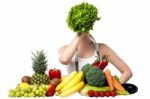 Beautiful Woman Hiding Her Face With Spinach Stock Photo