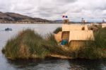 Thatched Home On Floating Islands On Lake Titicaca, Puno, Peru, Stock Photo