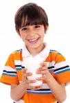 Young Kid Holding A Glass Of Milk Stock Photo