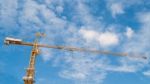 Yellow Construction Tower Crane With Blue Sky Stock Photo