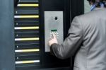 Man Entering Security Code To Unlock The Door Stock Photo