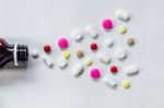 Top View Of The Pills On The White Background, The Drug And Capsule Pills On The Floor Stock Photo