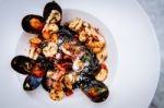  Squid Ink Pasta With King Prawns Stock Photo