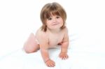 Toddler In Diapers Trying To Crawl Stock Photo