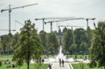 Multitude Of Cranes Towering Over The Gardens Of The Cathedral I Stock Photo