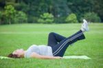 Fat Woman Lying By Exercise Leg Upwards Stock Photo