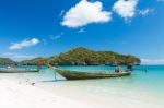 Long Tail Boat In Clear Water And Blue Sky Stock Photo