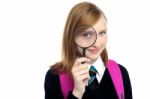 Teenager Looking Through A Magnifying Glass Stock Photo