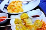 Dumpling With Dipping Sauce Stock Photo