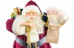 Model Of Santa Claus With Ringing Bell Gifts And Money Stock Photo