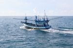Thailand Local Fishery Boat Running Over Blue Sea Water Stock Photo