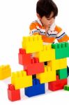 Boy Playing With Building Blocks Stock Photo