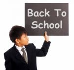 Schoolboy With Back To School Sign Stock Photo