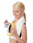 Girl Holding Water Bottle And Fruit Stock Photo