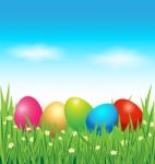 Colorful Easter Eggs On Green Grass Stock Photo