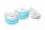 Two Blue Triangle Cosmetic Jar On White Background Stock Photo