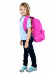 Happy Little Girl Carrying School Bag Stock Photo
