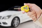 Hand Holding Key To A Car Stock Photo