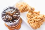 Set Of Iced Cola Drink And Fried Chicken Stock Photo