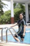 Ten Years Old Girl Playing In Swimming Pool Stock Photo