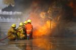Fireman. Firefighters Fighting Fire During Training Stock Photo