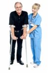 Experienced Physician Assisting Her Patient In Recovery Process Stock Photo