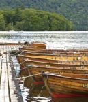 Wooden Rowing Boats Tied Stock Photo