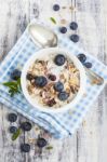 Bowl Of Muesli With Fresh Blueberries On White Wooden Table Stock Photo