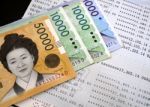 Korean Banknote On Bank Statement Stock Photo