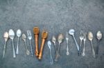 Various Cooking Utensils Border. Spoons And Fork On Dark Stone B Stock Photo