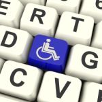 Disabled Key Shows Wheelchair Access Or Handicapped Stock Photo