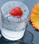 Strawberry On Sparkling Water Stock Photo
