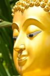 Golden Buddhist Statue Face Stock Photo