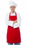 Male Chef Standing With Arms Crossed Stock Photo