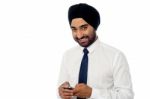 Young Businessman Using Mobile Phone Stock Photo