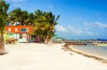 Wooden Pier Dock, Boats And Ocean View At Caye Caulker Belize Ca Stock Photo